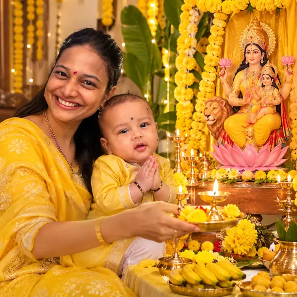Golden Devotion: Mother and Child Worshipping Maa Skandamata